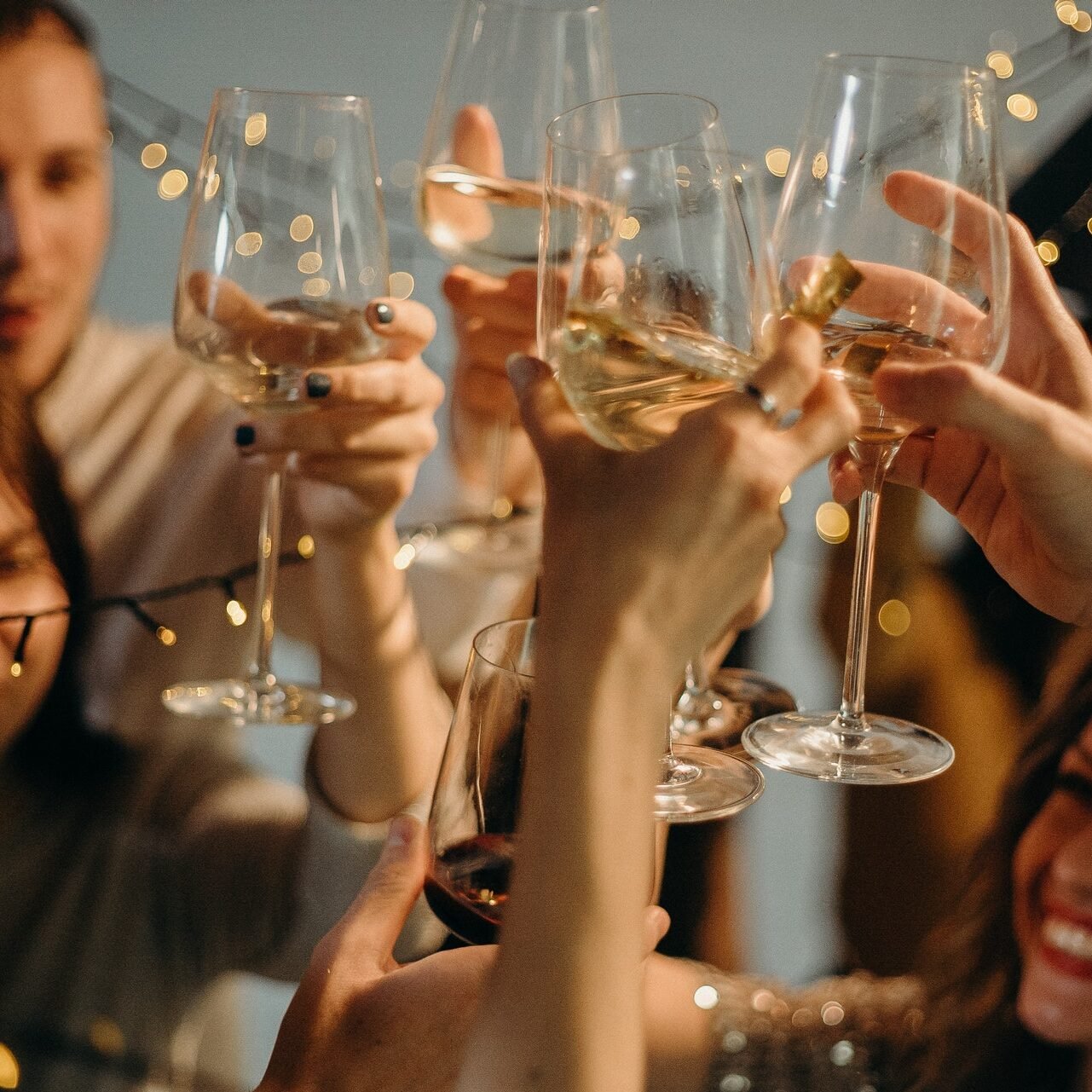 selective-focus-photography-of-several-people-cheering-wine-3171815